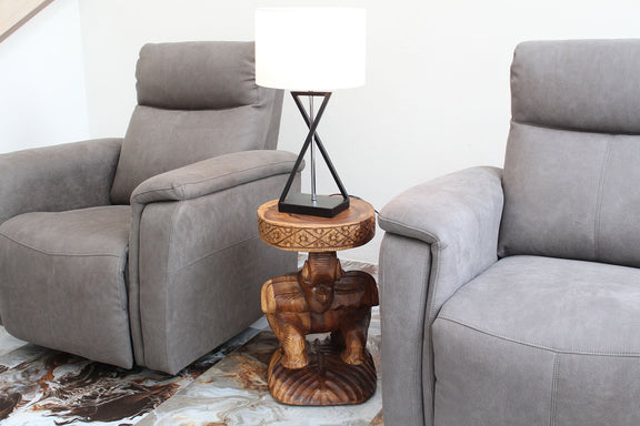 Haussmann Elephant Chang Hand-Carved Solid Wood End Table, Walnut, 14 in dia x 22 in H, in a room with a lamp on top